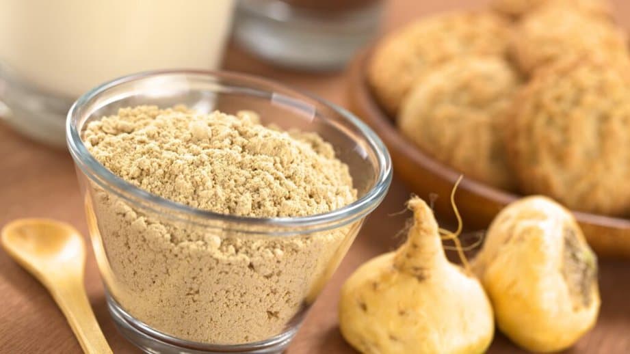 Maca root and powder in a glass