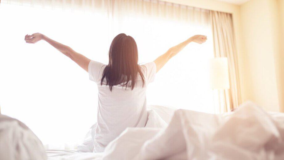 woman waking up in the morning