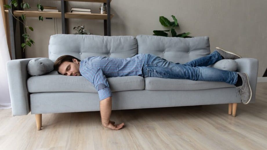 man asleep on the couch