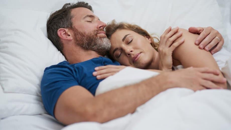 Couple sleeping in bed