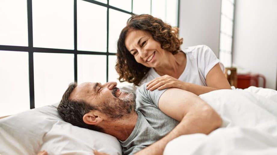 couple waking up in bed