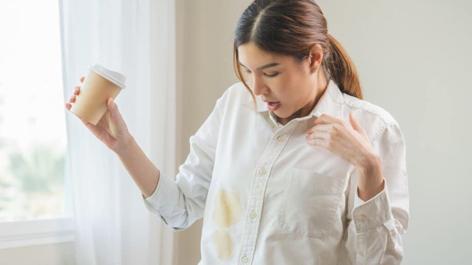 woman spilled coffee on her shirt