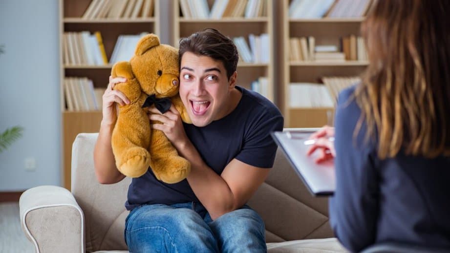 man holding teddy bear