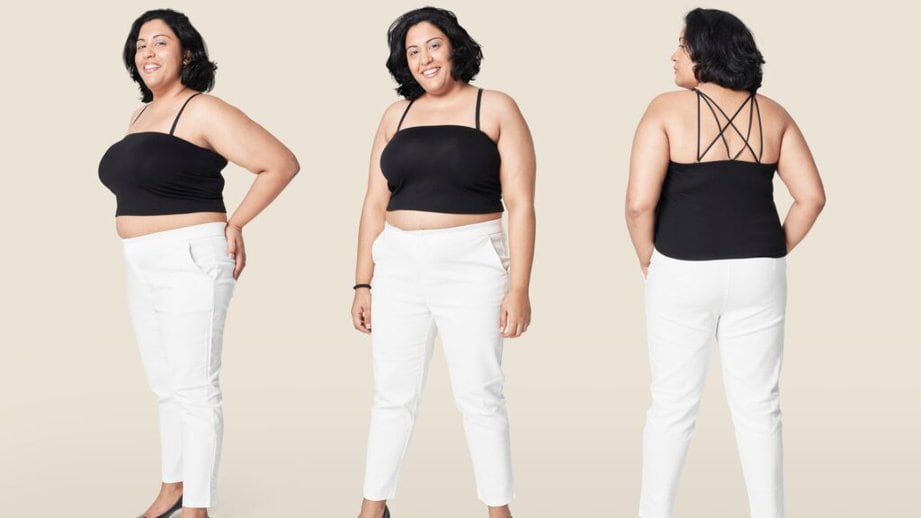 plus sized model in tank top and fitted pants