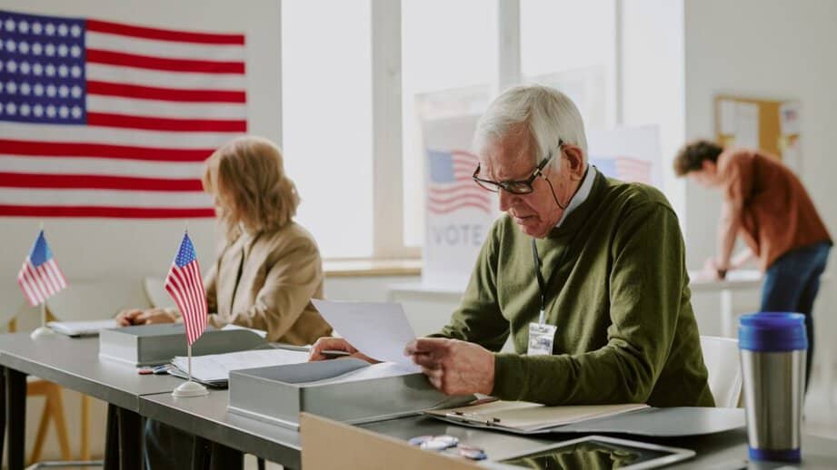 older people at a voting station