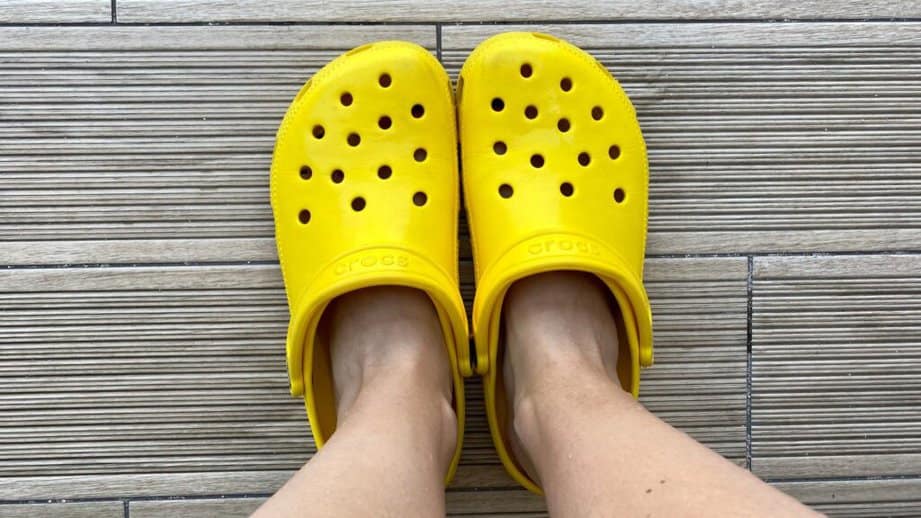 yellow crocs shoes on feet