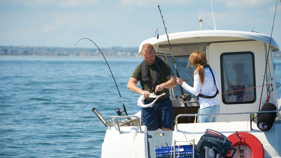 couple fishing on a boat