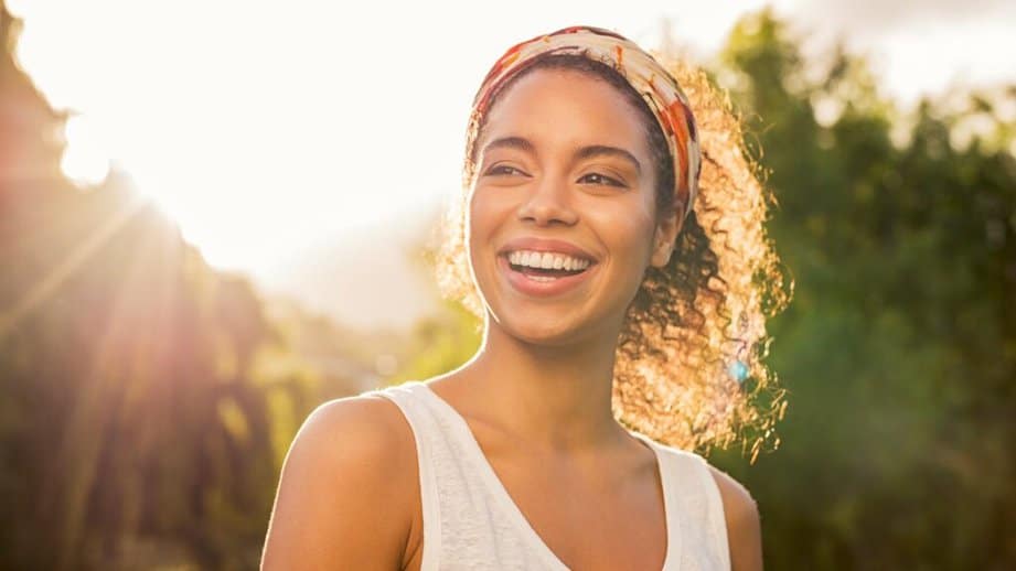 woman smiling in the sunshine