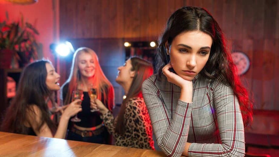 woman bored and alone at a party