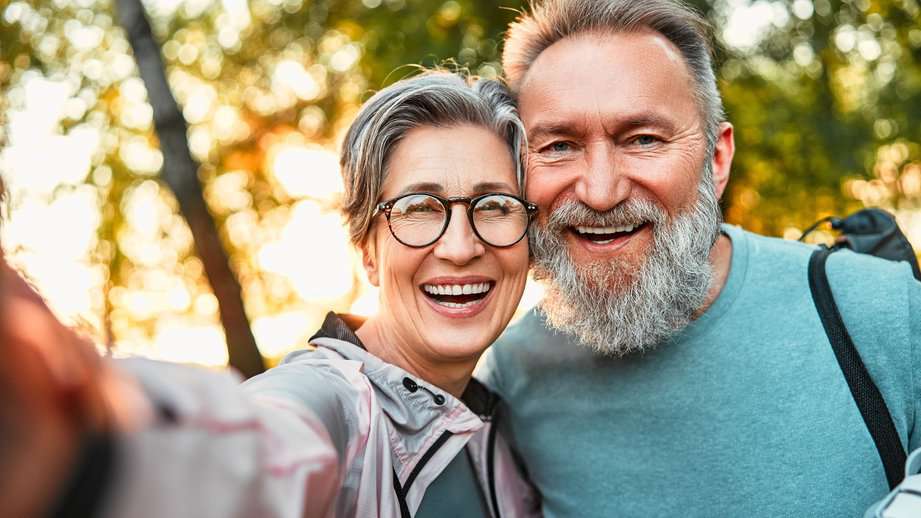 older couple taking a selfie