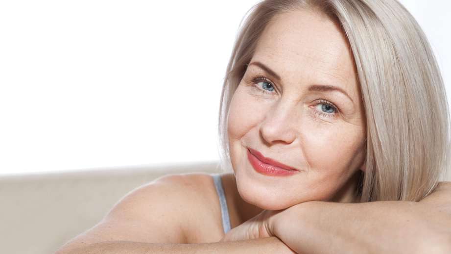 beautiful middle aged mature woman arms folded