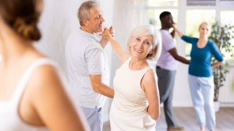 mature couple dancing in ballroom dance class hobbies