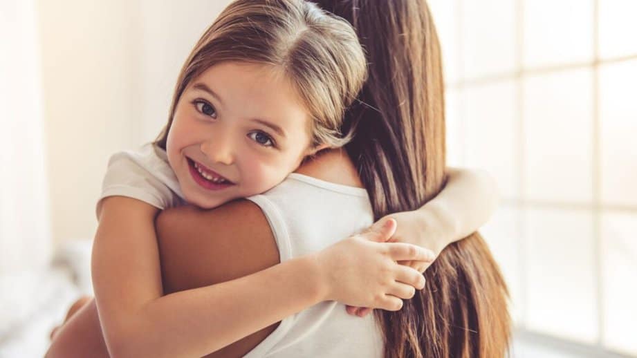 mom and daughter hugging