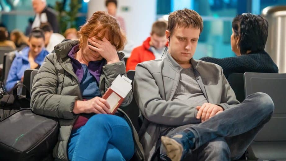 two travelers tired in the airport