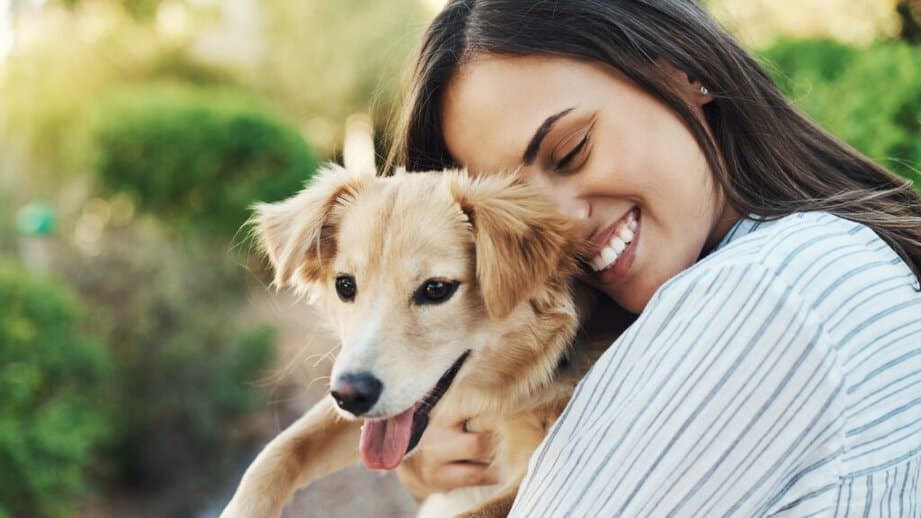 woman hugging her dog