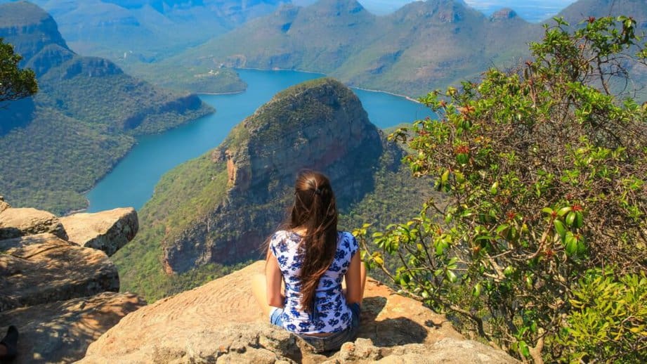 woman sitting on Blyde River Canyon South Africa