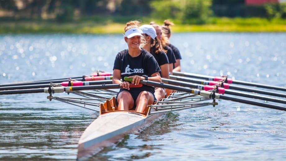 women rowing in a boat