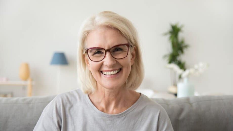 happy older woman smiling at the camera