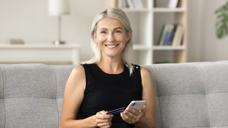 smart older woman with a credit card