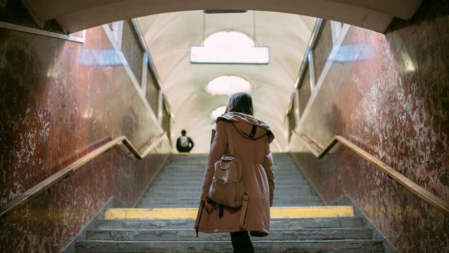 woman walking alone in train station