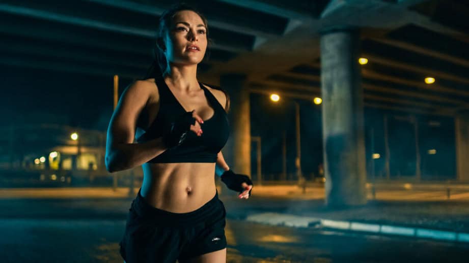 woman running at night alone