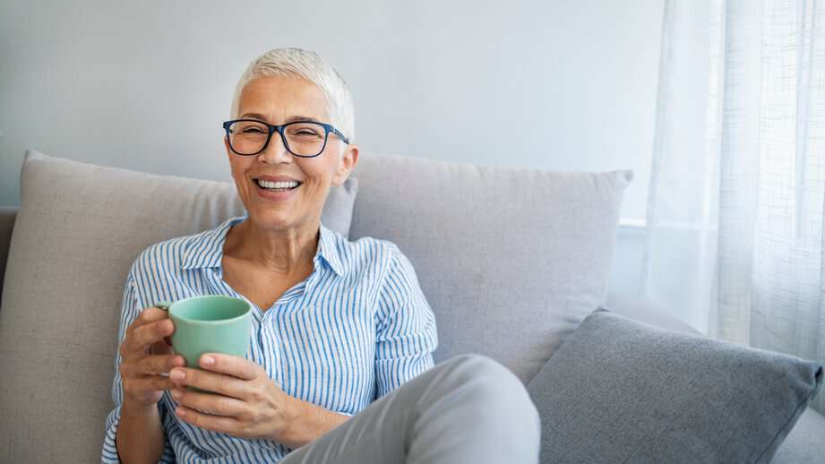 happy mature woman drinking coffee