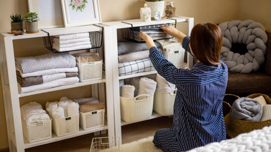 woman organizing home shelves