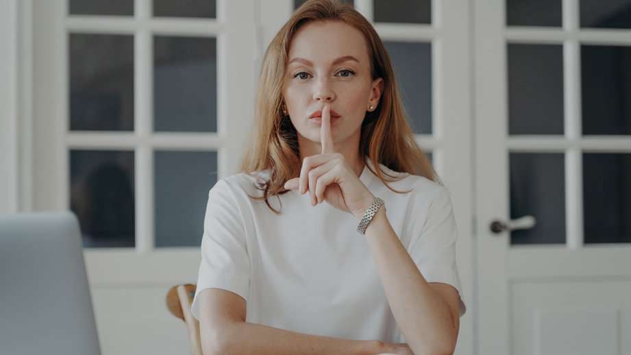 woman with a secret at desk